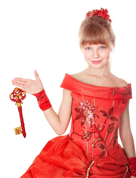 Παιδί σε μακρύ κοκκινωπό φόρεμα κρατώντας πατημένο το πλήκτρο Χριστούγεννα,. — Φωτογραφία Αρχείου