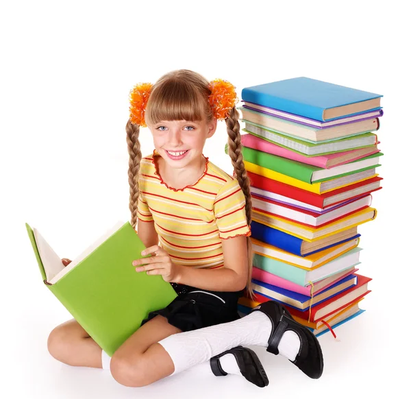 Schoolgirl reading pile of books. — Stock Photo, Image