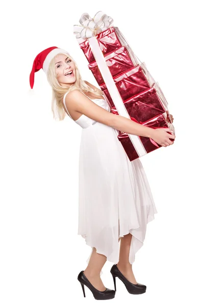 Kerstmis meisje in Kerstman hoed houden de doos van de gift van de stapel. — Stockfoto