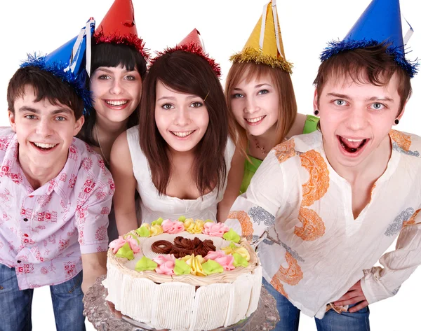 Группа в шляпе партии едят торт . Лицензионные Стоковые Изображения