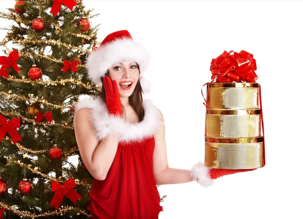 Christmas girl in santa hat holding stack gift box. Stock Photo