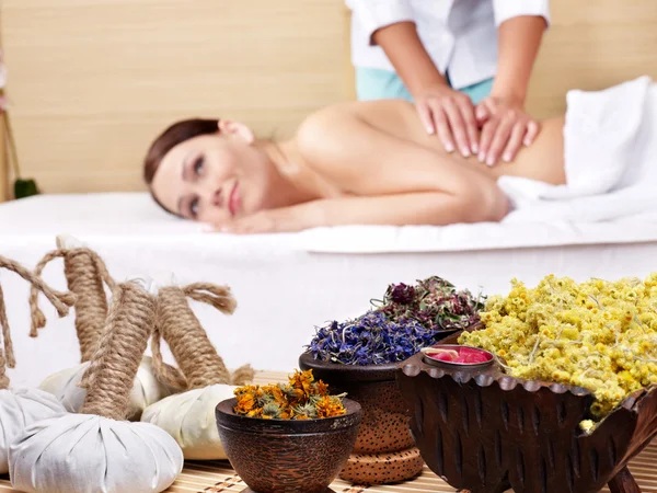 Young woman on massage table in beauty spa. Royalty Free Stock Images
