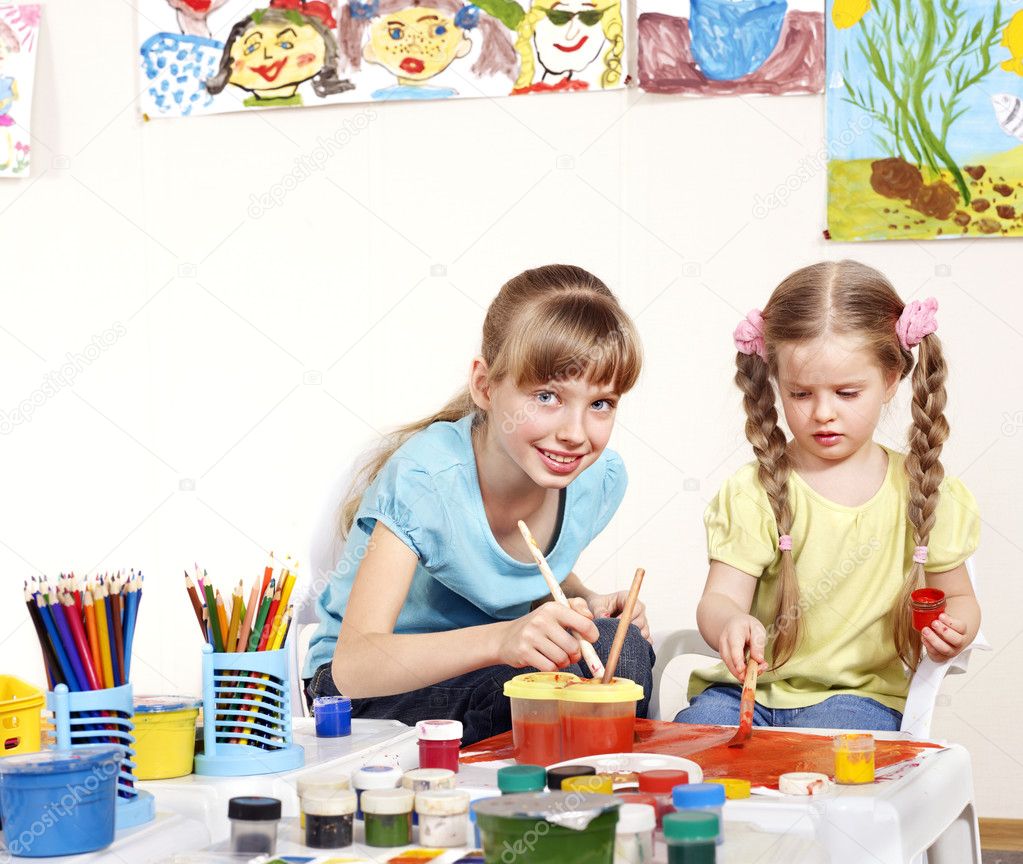Child painting in preschool.