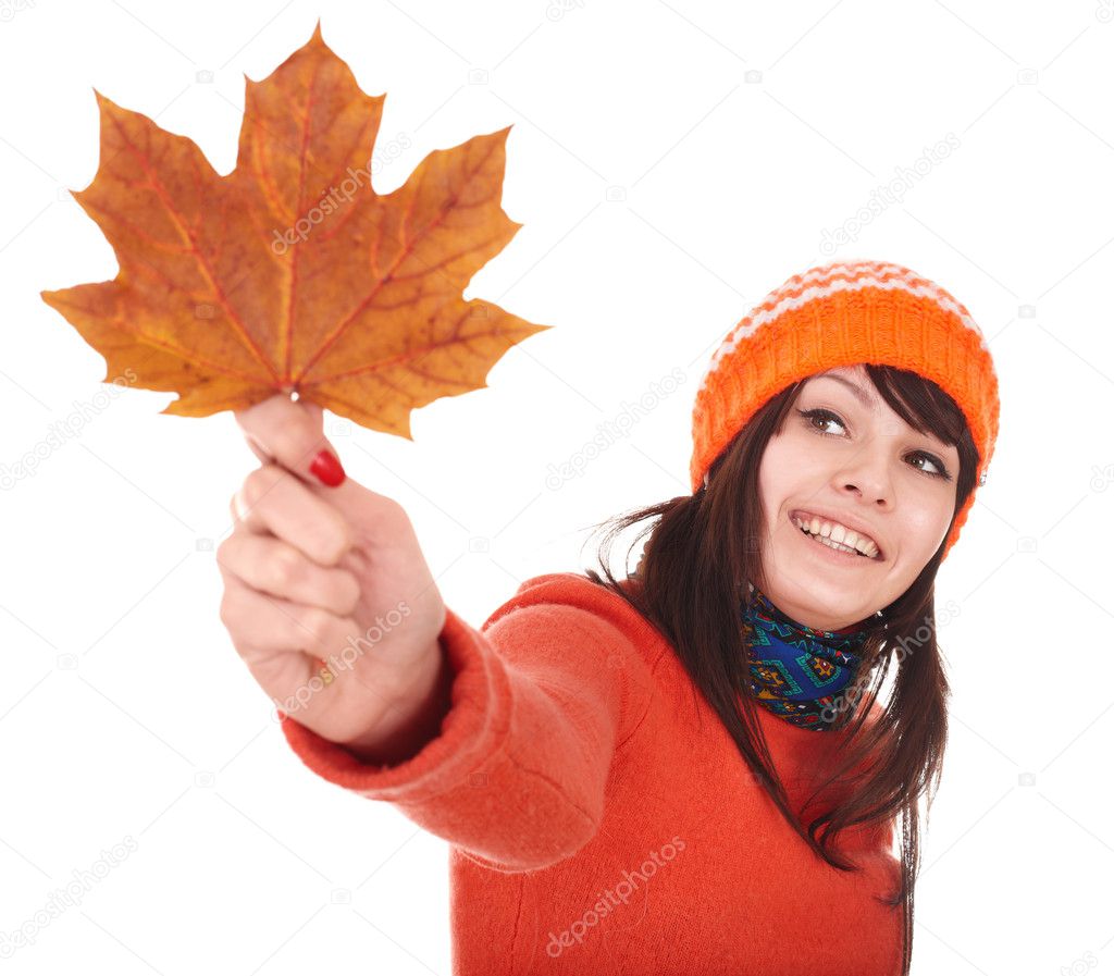 Girl holding autumn orange maple leaf.
