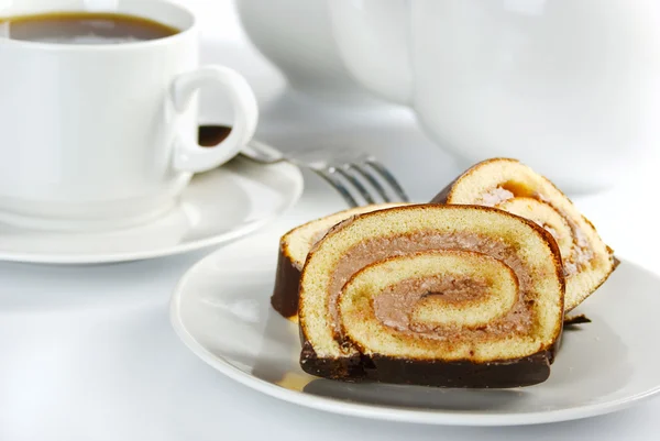 stock image Roll and cup of tea