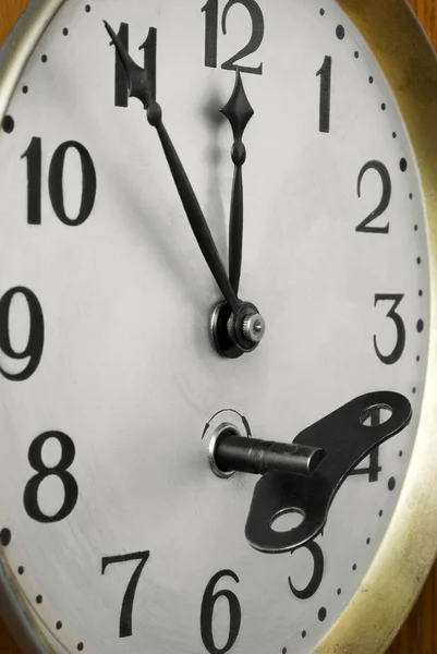 Cara de relógio e chave — Fotografia de Stock