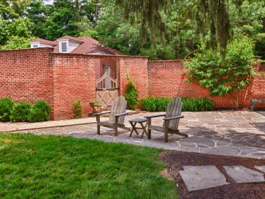 Cape cod chairs on stone patio clipart