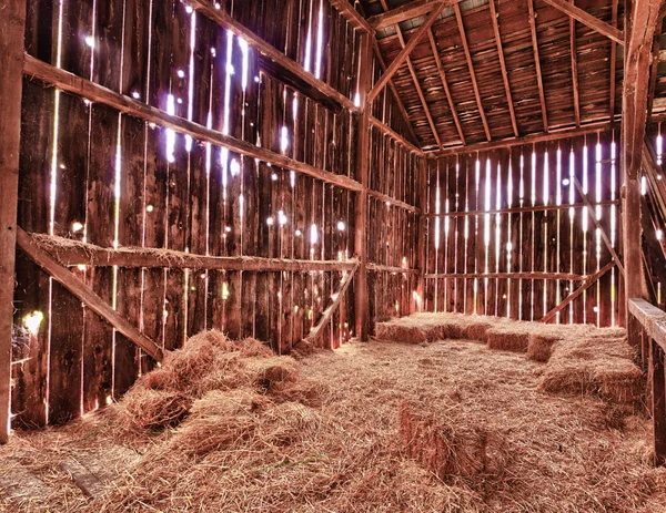 stock image Interior of old barn with straw bales