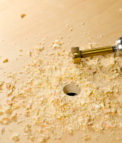 Woodwork tools working on piece of plywood — Stock Photo, Image