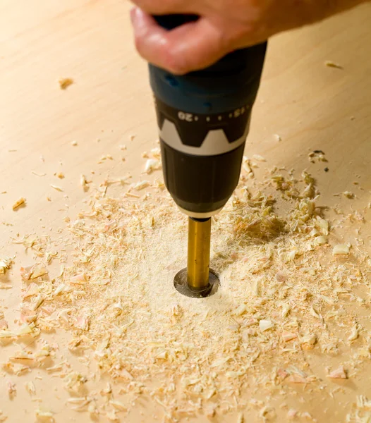 Woodwork tools working on piece of plywood — Stockfoto