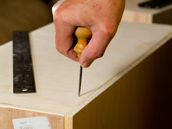 Woodwork tools working on piece of plywood — Stock Photo, Image