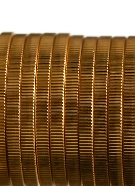 Kantenansicht eines Stapels goldener Münzen — Stockfoto