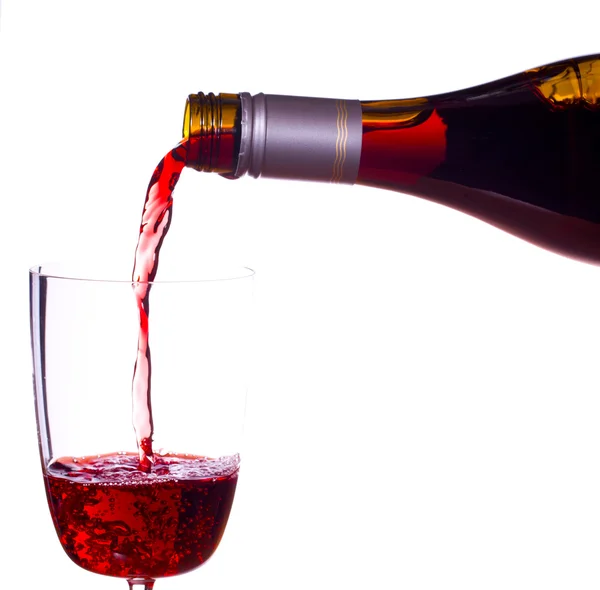 Red wine being poured into glass — Stock Photo, Image