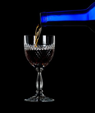 Sherry or port being poured into glass clipart