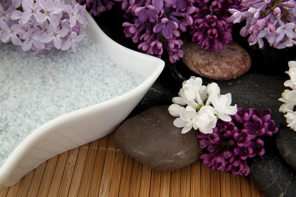 Lilacs and bath salt Stock Image
