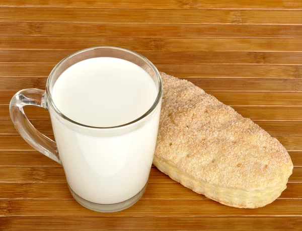 stock image Puff cake and a glass of milk