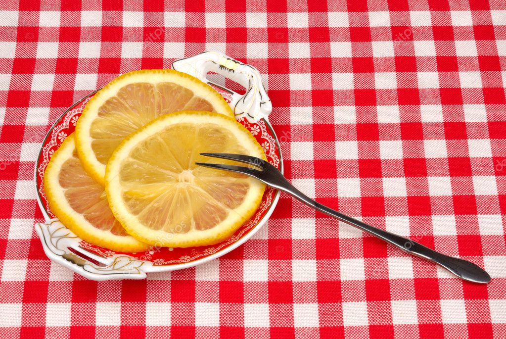 Lemon on a plate with a fork