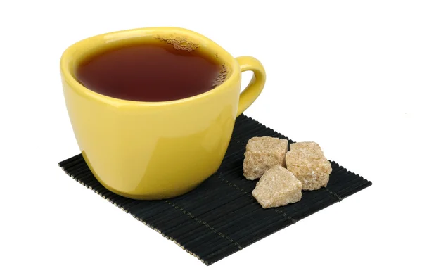Tea and sugar cane on the mat — Stock Photo, Image