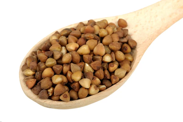 Buckwheat in a wooden spoon — Stock Photo, Image