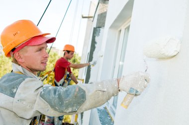 Builder facade painter at work clipart