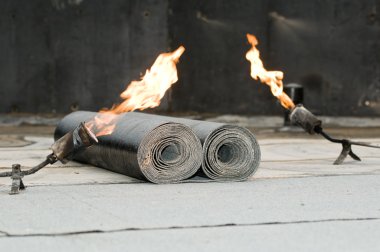 Tar roofing felt roll and blowpipe with flame clipart