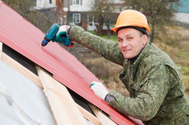 Roofing works with screwdriver clipart