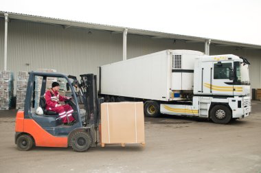 Forklift loader at warehouse outdoors clipart