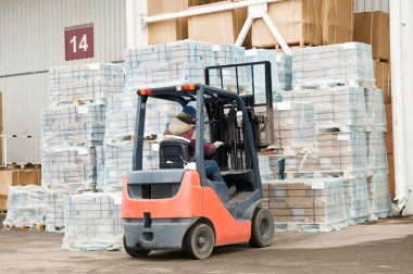 Warehouse forklift loader at work clipart