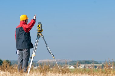 Surveyor theodolite worker clipart