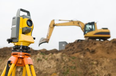 Surveyor theodolite on tripod clipart