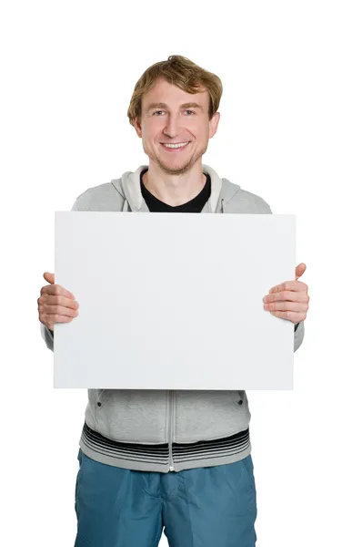 Молодий чоловік з рекламним щитом в руках — стокове фото