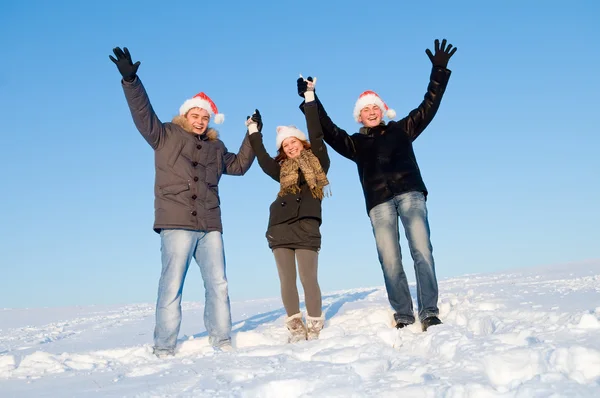 Teenagers with hands up in winter — Stock Photo, Image