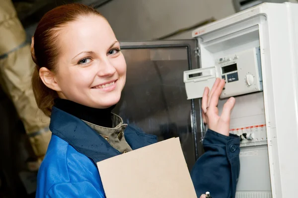 Cheerful woman engineer in a boiler room — Stock Photo, Image