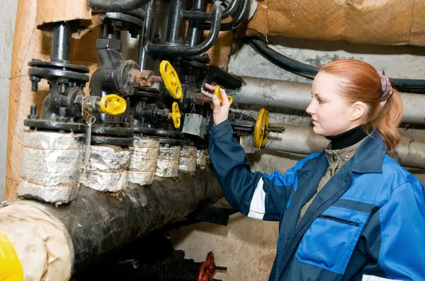 Woman engineer in a boiler room — Stock Photo, Image