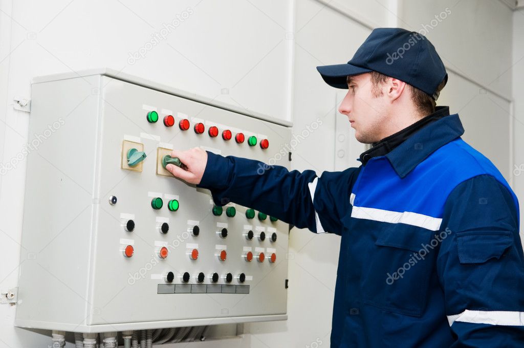 Electrician at voltage adjusting work