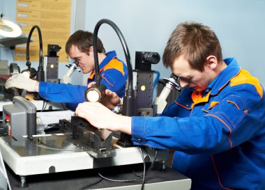 Two workers at tool workshop clipart