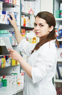 Pharmacy chemist woman in drugstore clipart