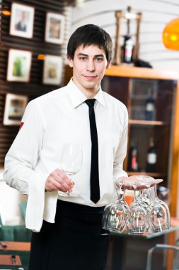 Waiter in uniform at restaurant clipart