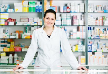 Pharmacy chemist woman in drugstore clipart