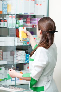 Pharmacy chemist woman in drugstore clipart