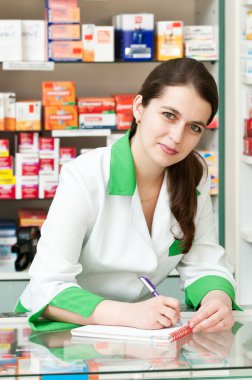 Pharmacy chemist woman in drugstore clipart