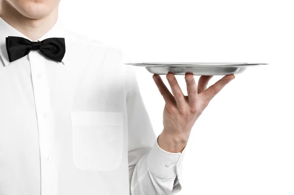Waiter hand with metal plate — Stock Photo, Image