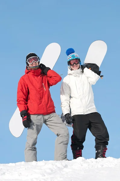 Šťastný sportovec s snowboardy — Stock fotografie