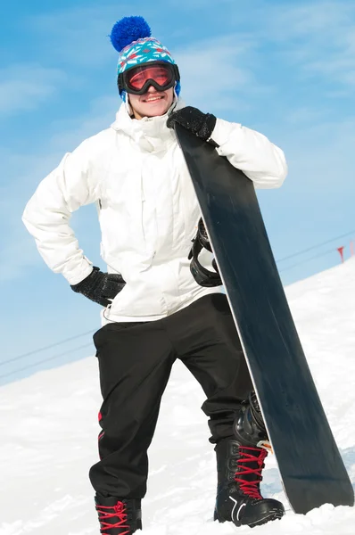 Happy sportsman with snowboards — Stock Photo, Image