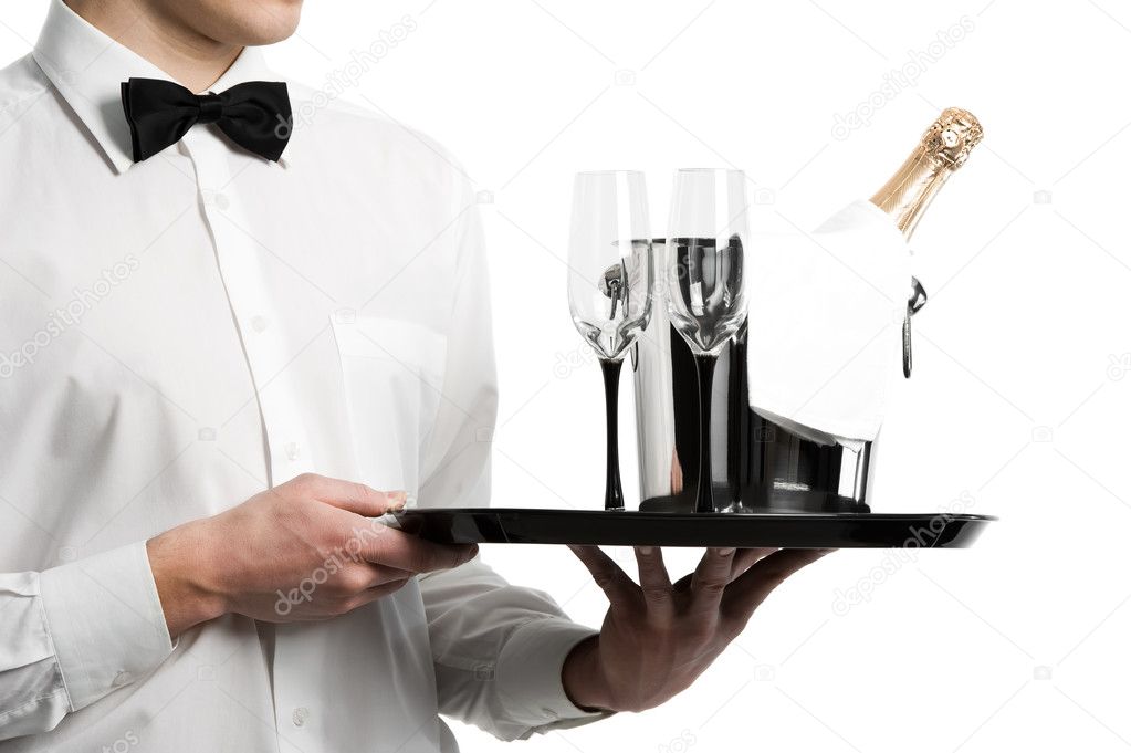 Waiter hands champagne in bucket and stemware on tray
