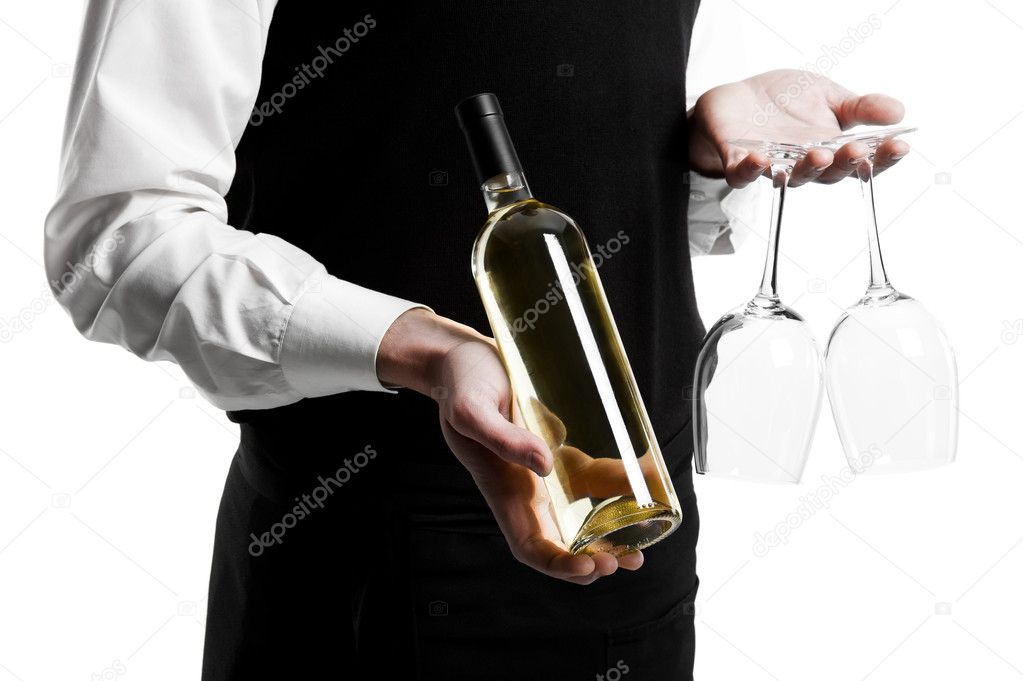 Waiter sommelier with wine bottle and stemware