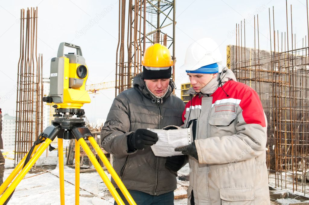 Surveying works at construction site