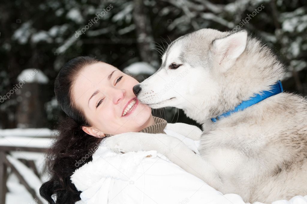 Happy siberian husky owner with dog