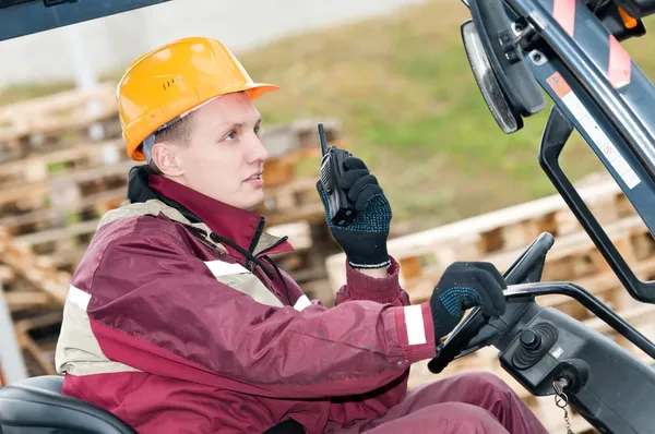 Forklift driver with radio transmitter — Stock Photo, Image