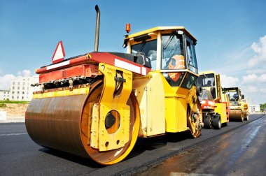 Asphalt roller at work clipart